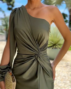 Woman wearing a green one-shoulder satin maxi dress with twist-knot waist and front slit - view 4