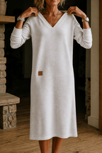 Woman wearing a relaxed A-line V-neck midi sweater dress with long sleeves - view 14