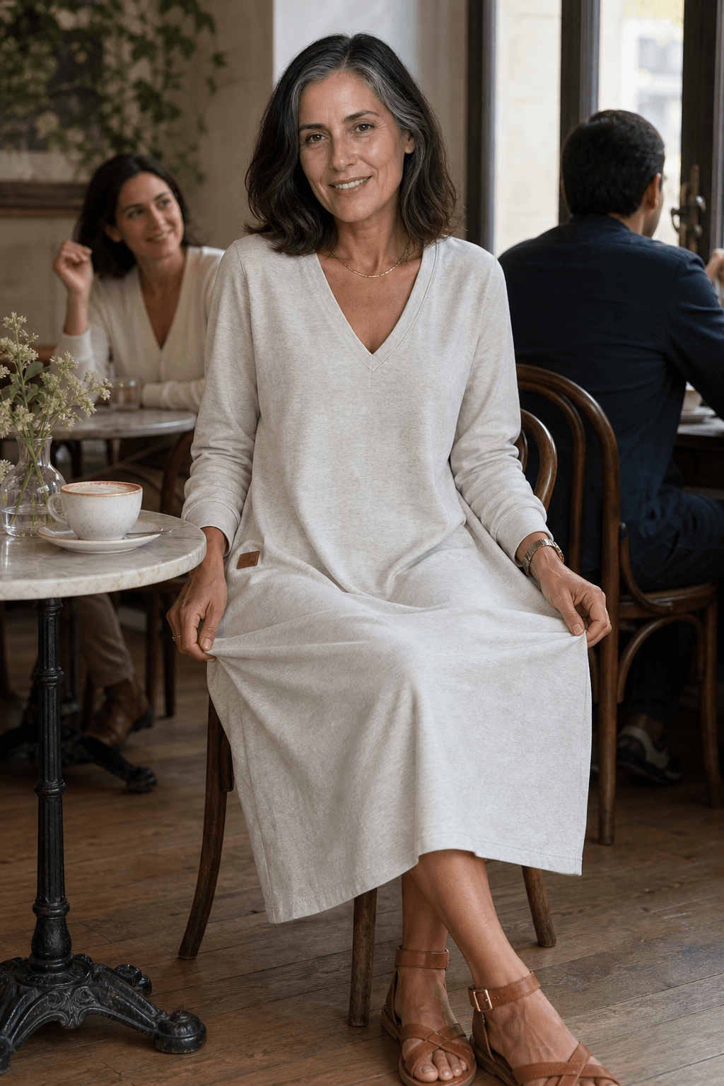 Woman wearing a relaxed A-line V-neck midi sweater dress with long sleeves - view 3