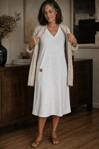 Woman wearing a relaxed A-line V-neck midi sweater dress with long sleeves - view 4
