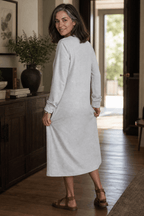 Woman wearing a relaxed A-line V-neck midi sweater dress with long sleeves - view 5