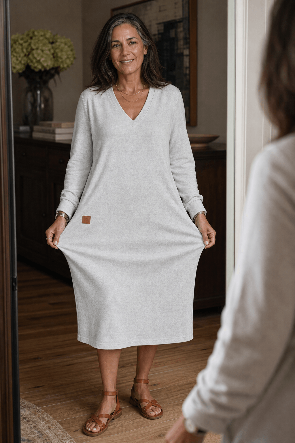 Woman wearing a relaxed A-line V-neck midi sweater dress with long sleeves - view 6