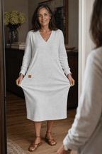 Woman wearing a relaxed A-line V-neck midi sweater dress with long sleeves - view 6
