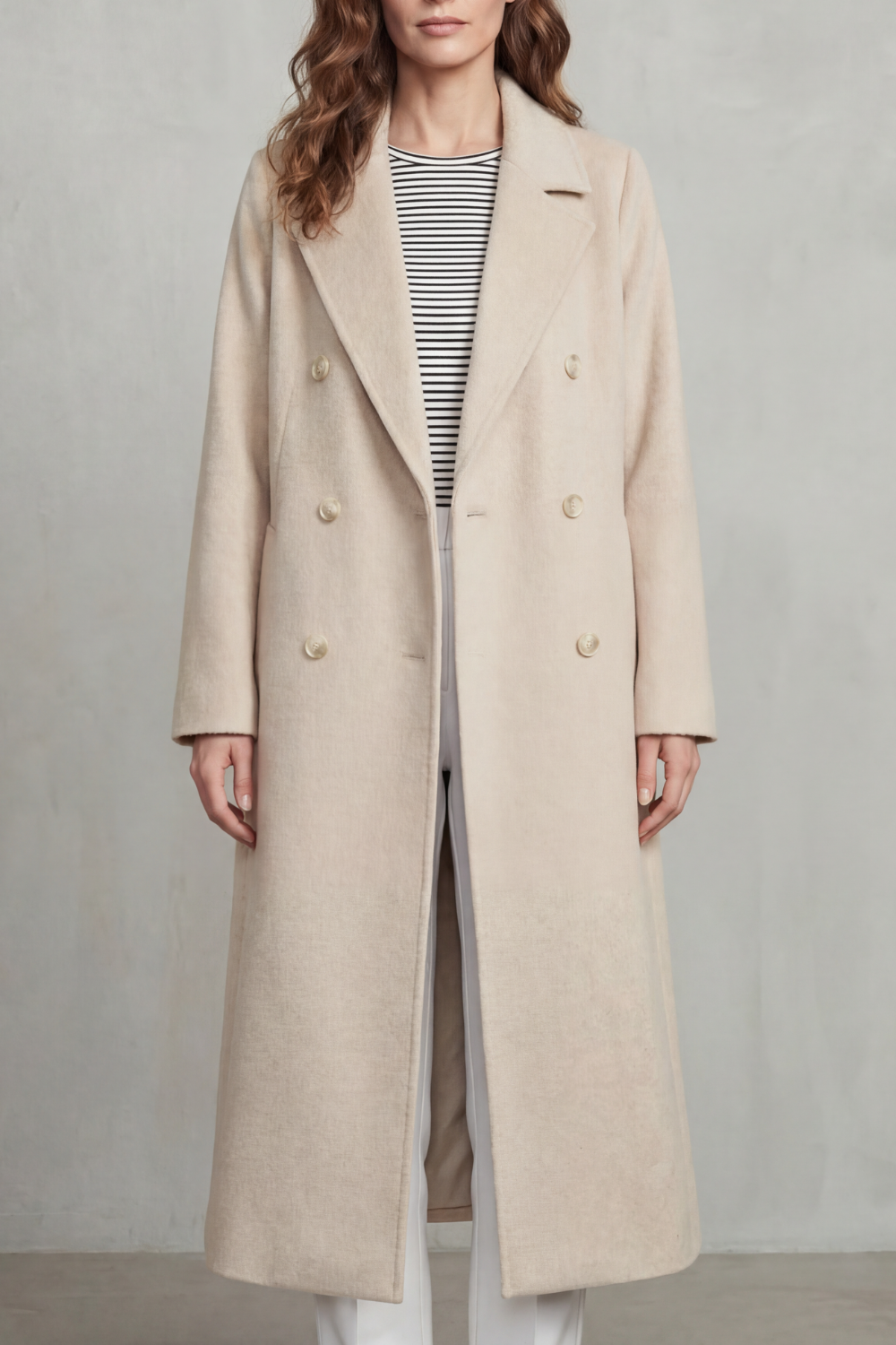 Woman wearing a long black double-breasted coat with notch lapels and six buttons - view 7