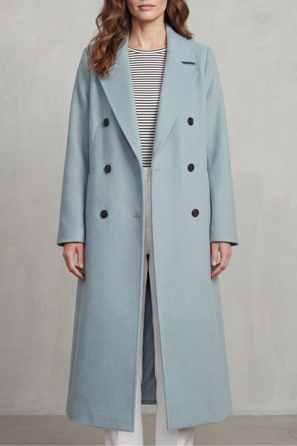 Woman wearing a long black double-breasted coat with notch lapels and six buttons - view 9