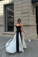 Black and ivory paneled maxi dress with spaghetti straps and flared godet skirt - view 12