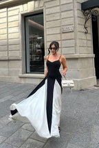 Black and ivory paneled maxi dress with spaghetti straps and flared godet skirt - view 13