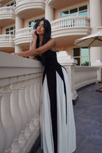 Black and ivory paneled maxi dress with spaghetti straps and flared godet skirt - view 9