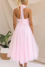 Woman wearing a sleeveless tulle halter midi dress with ruched bodice and full skirt - view 10