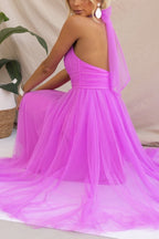 Woman wearing a sleeveless tulle halter midi dress with ruched bodice and full skirt - view 6