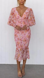 Pink floral smocked midi dress with plunging V-neck, sheer balloon long sleeves and ruffle hem