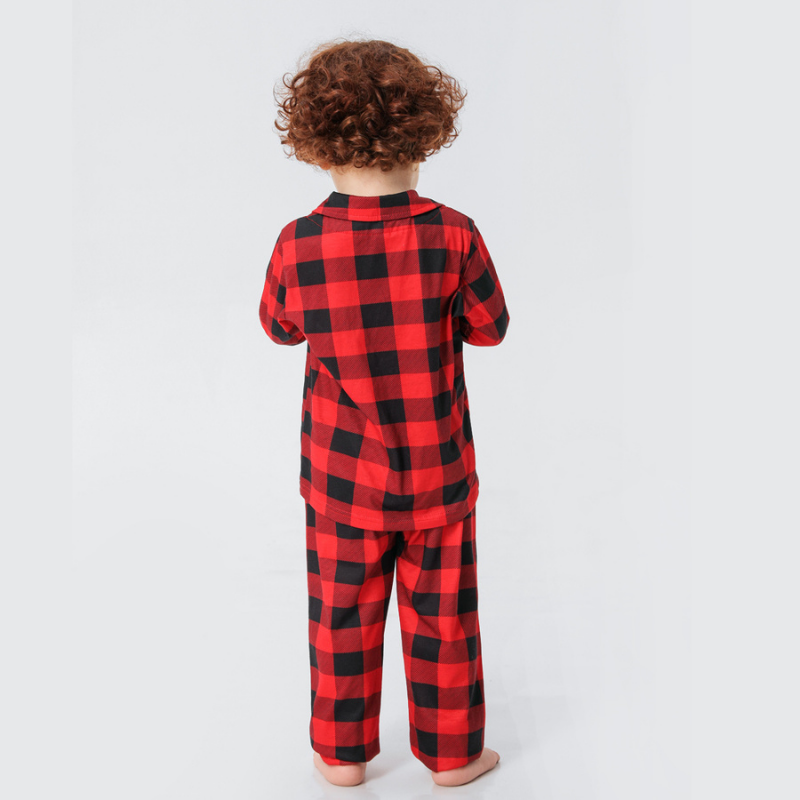 Family wearing matching red and black buffalo plaid Christmas pajamas - view 12