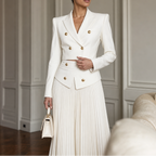 Double-breasted white cropped blazer with gold-tone buttons and matching pleated skirt