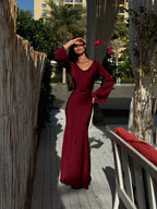 Woman wearing a fitted satin long sleeve maxi dress with bell sleeves and wide scoop neckline - view 11
