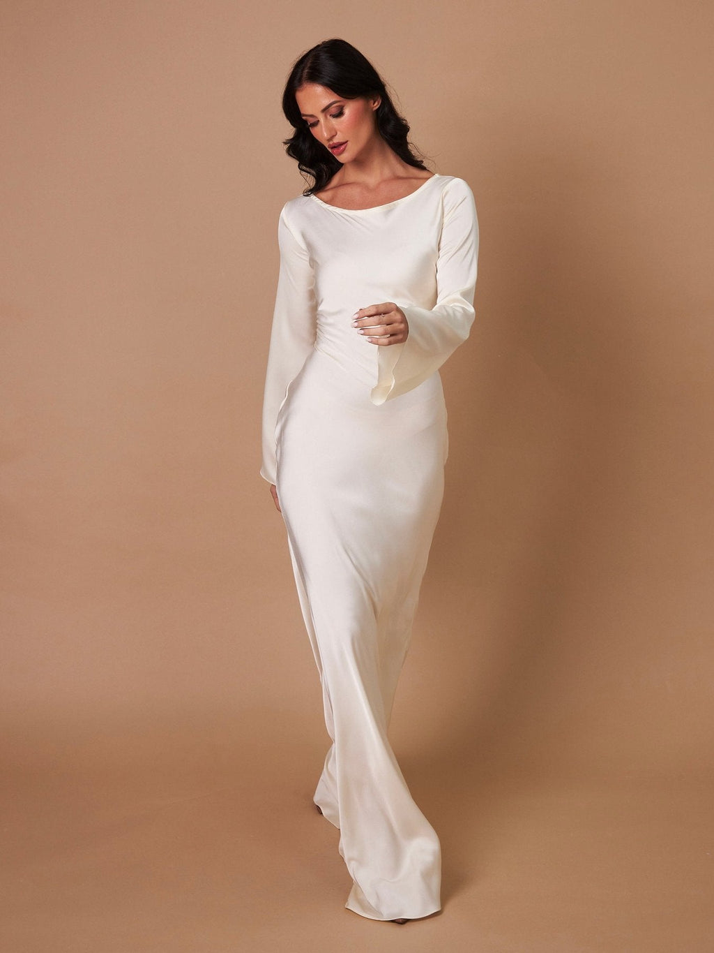 Woman wearing a fitted satin long sleeve maxi dress with bell sleeves and wide scoop neckline - view 13