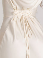 Woman wearing a fitted satin long sleeve maxi dress with bell sleeves and wide scoop neckline - view 14