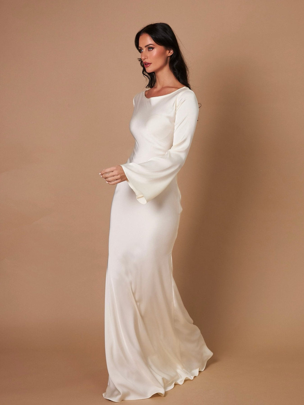 Woman wearing a fitted satin long sleeve maxi dress with bell sleeves and wide scoop neckline - view 15