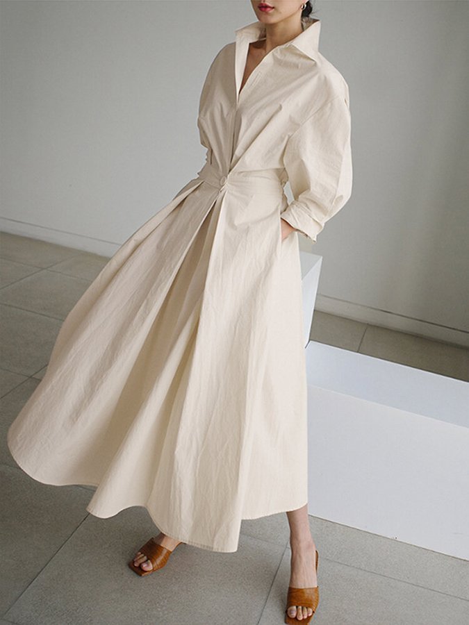 Woman wearing a long sleeve maxi shirt dress with collar, button waist and pleated A-line skirt - view 2