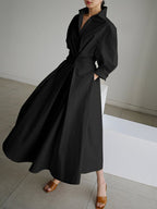 Woman wearing a long sleeve maxi shirt dress with collar, button waist and pleated A-line skirt - view 5