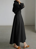 Woman wearing a long sleeve maxi shirt dress with collar, button waist and pleated A-line skirt - view 6