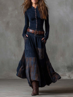 Navy long sleeve maxi dress with button-front bodice and plaid patchwork skirt