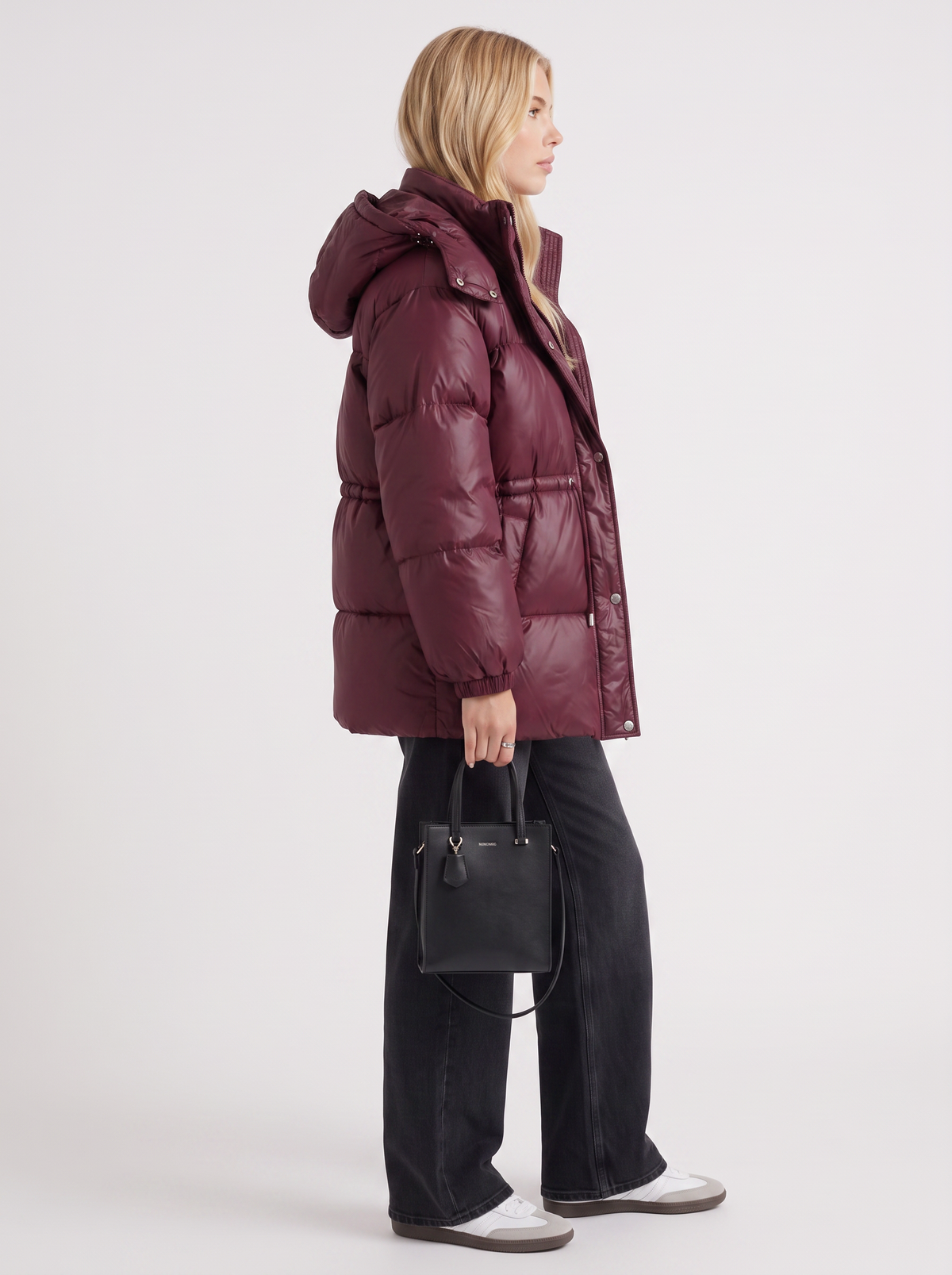 Woman in a brown quilted hooded puffer jacket with drawstring waist - view 10