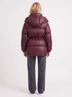 Woman in a brown quilted hooded puffer jacket with drawstring waist - view 11