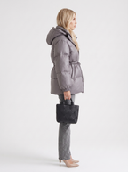 Woman in a brown quilted hooded puffer jacket with drawstring waist - view 15