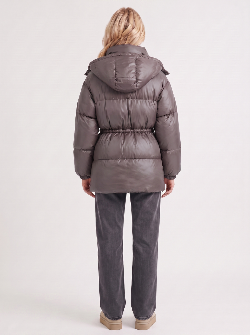 Woman in a brown quilted hooded puffer jacket with drawstring waist - view 16