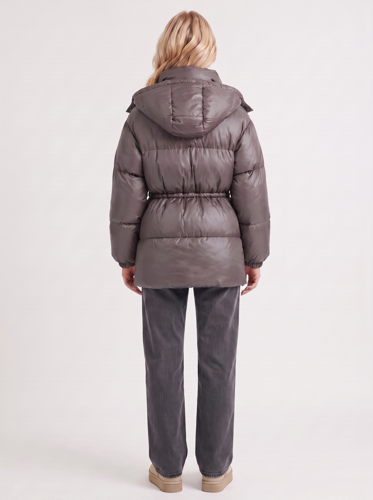 Woman in a brown quilted hooded puffer jacket with drawstring waist - view 16