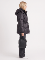 Woman in a brown quilted hooded puffer jacket with drawstring waist - view 22