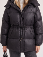 Woman in a brown quilted hooded puffer jacket with drawstring waist - view 24