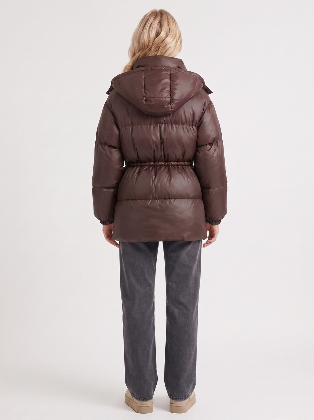 Woman in a brown quilted hooded puffer jacket with drawstring waist - view 5