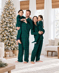 Matching family Christmas pajamas in plaid with collared adult tops and kids crew-neck sets