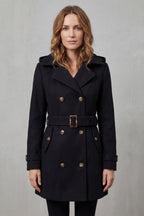 Woman wearing a black hooded double-breasted belted trench coat - view 2