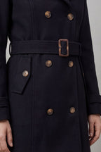 Woman wearing a black hooded double-breasted belted trench coat - view 5