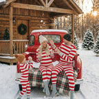 Family in matching red and white striped Christmas pajamas with gray cuffs - view 16