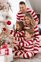 Family in matching red and white striped Christmas pajamas with gray cuffs - view 3