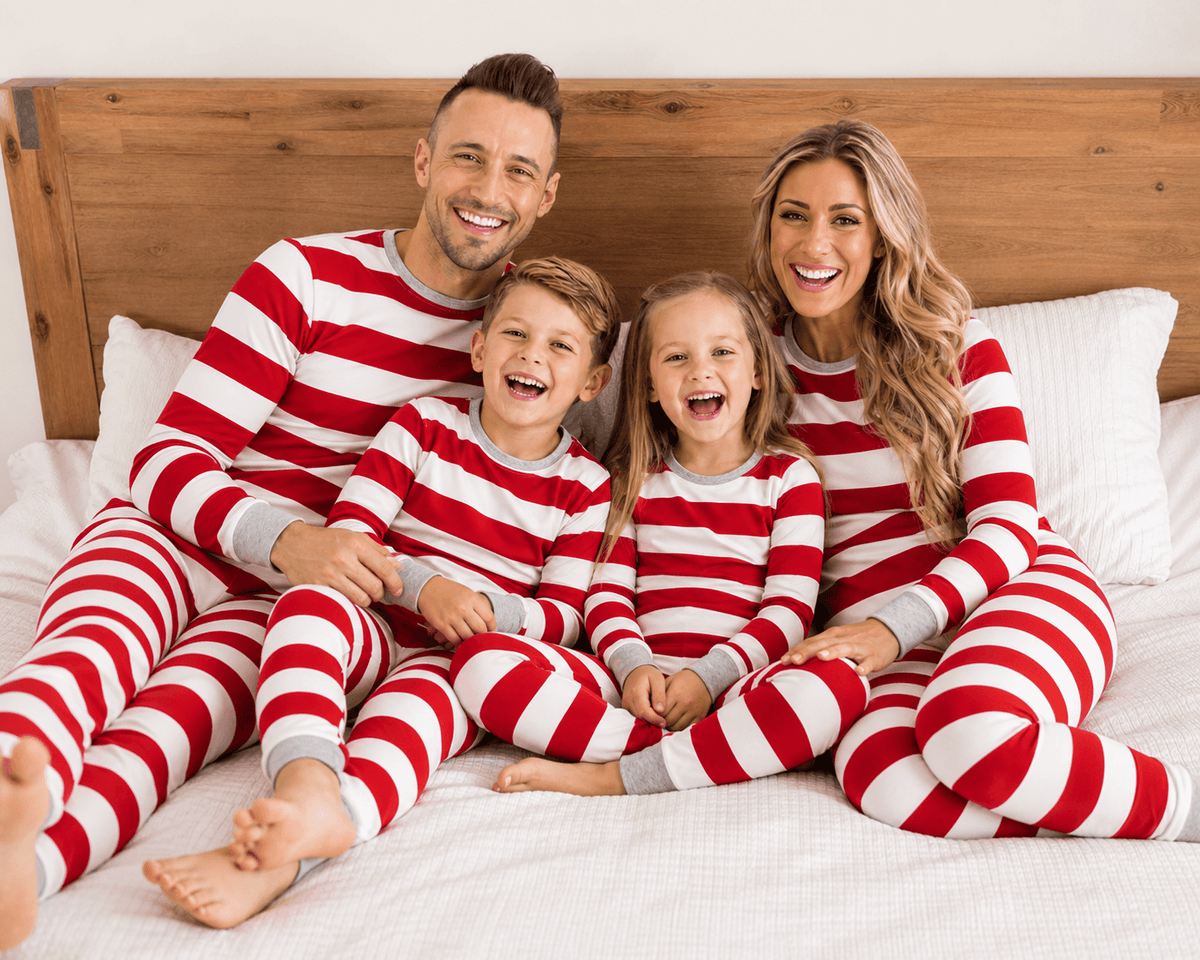 Family in matching red and white striped Christmas pajamas with gray cuffs - view 4