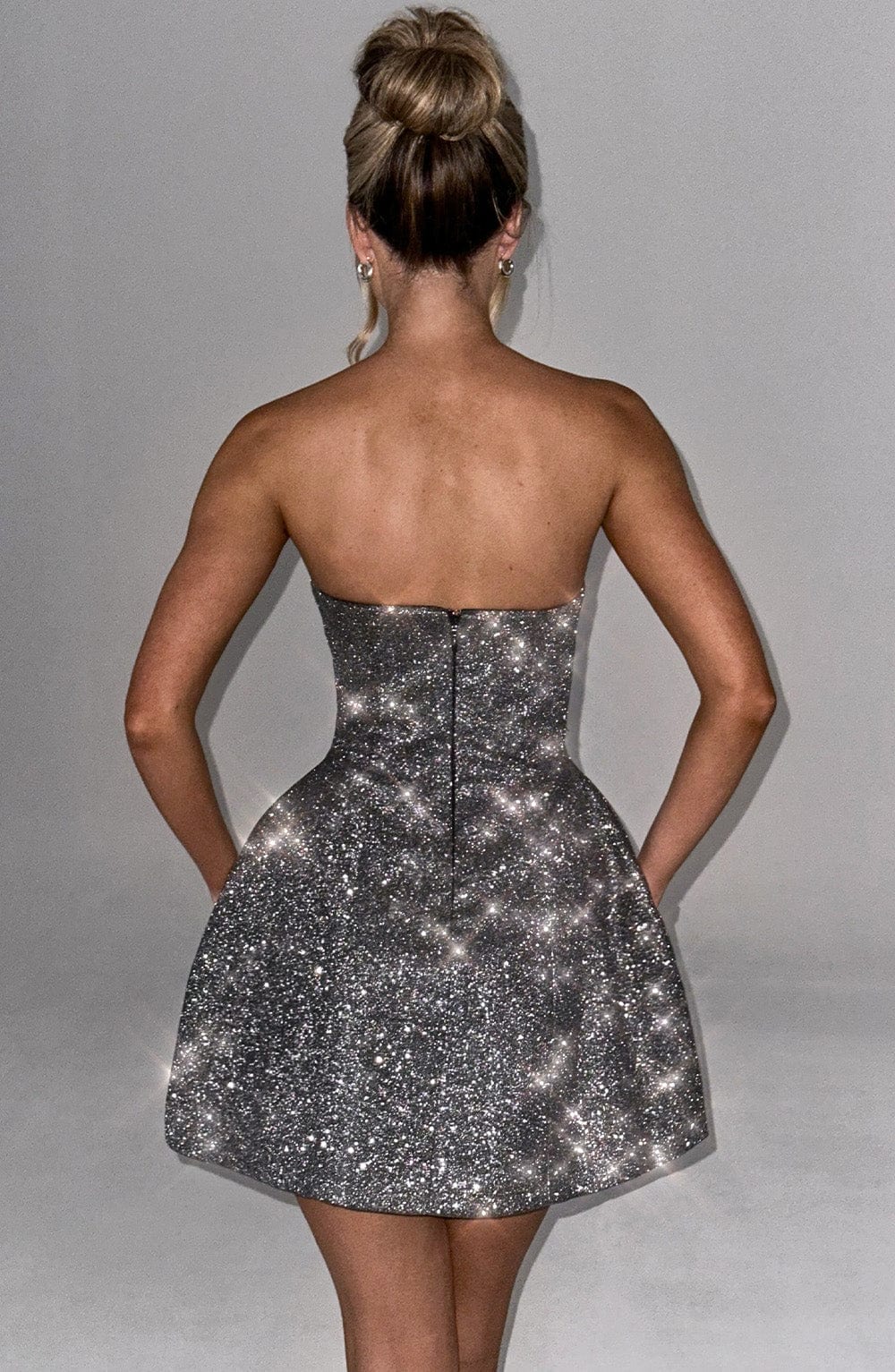 Strapless glitter mini dress with oversized back bow and structured A-line skirt - view 9