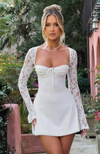 Long sleeve lace mini dress with sweetheart neckline and lace-up open back