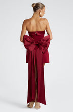 Woman wearing a white strapless A-line mini dress with an oversized back bow and long trailing tails - view 8