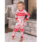 Family wearing matching red and white reindeer and snowflake print Christmas pajamas - view 3