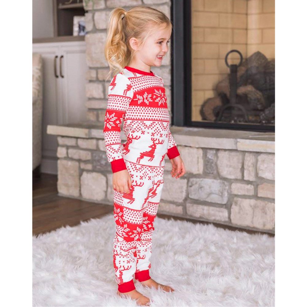 Family wearing matching red and white reindeer and snowflake print Christmas pajamas - view 7