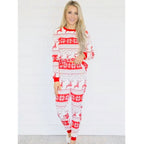 Family wearing matching red and white reindeer and snowflake print Christmas pajamas - view 9
