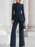 Tailored stand-collar blazer and wide-leg suit pants on model