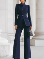 Tailored stand-collar blazer and wide-leg suit pants on model