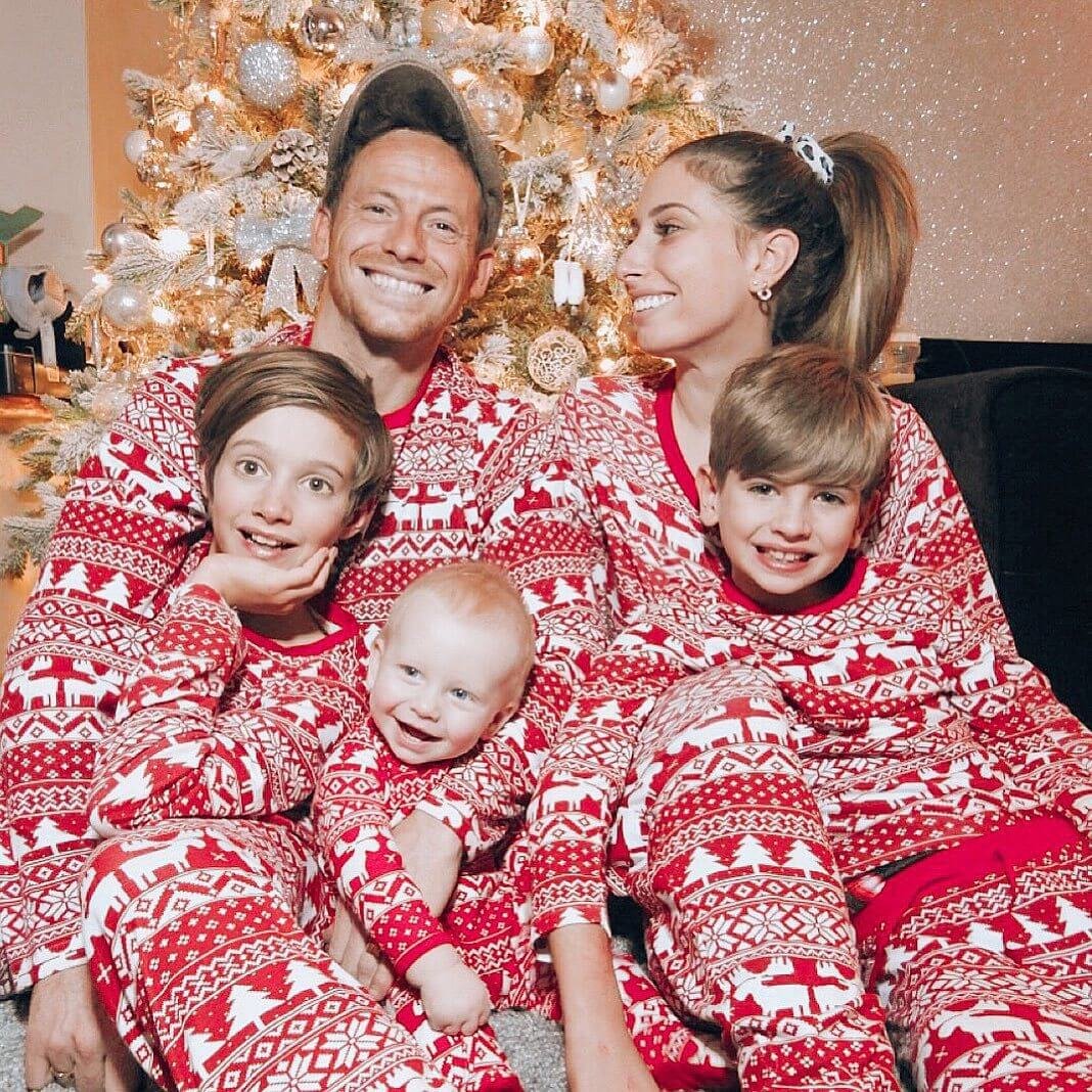 Red and white fair isle family Christmas pajamas with reindeer, tree and snowflake print - view 2