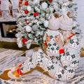White snowflake print family Christmas pajamas with red cuffs
