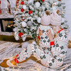 White snowflake print family Christmas pajamas with red cuffs